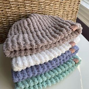 Gorgeous handmade hats made with cloud like yarn. Cozy, perfect for winter